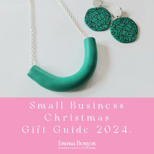 A chunky green necklace on a silver chain next to a pair of jade green clay earrings.